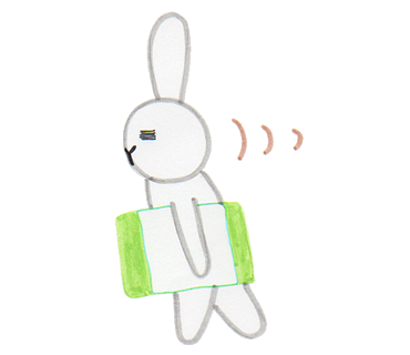 枕を持って歩いている白うさぎのイラスト